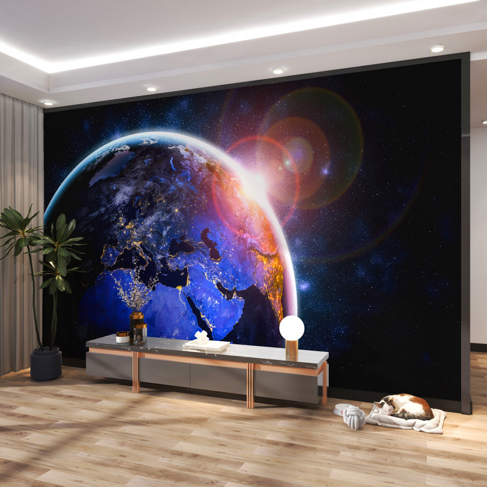 Fototapeta jasny zachód słońca nad ziemią