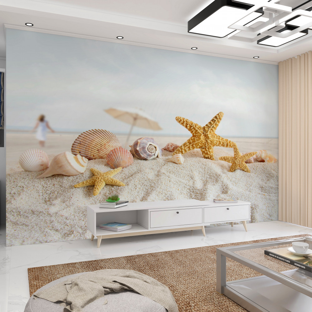 Fototapeta muszle i rozgwiazdy na piasku