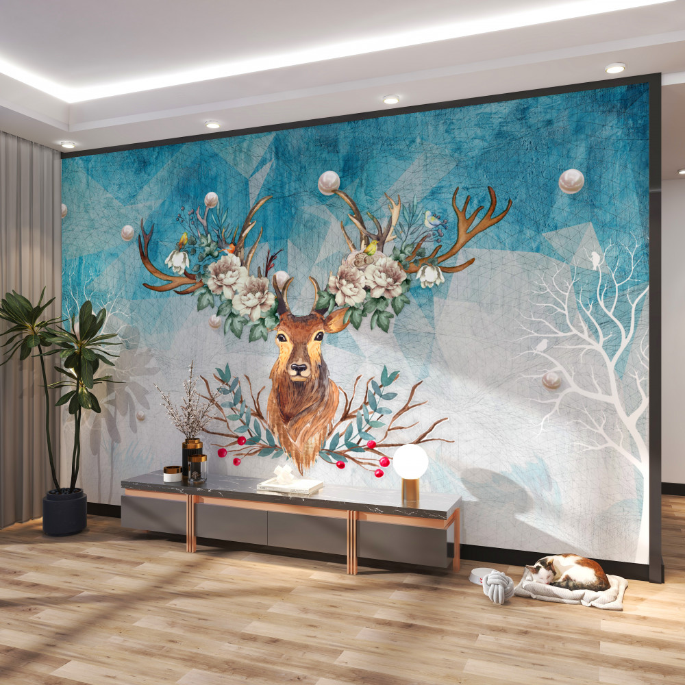 Fototapeta jelenie z kwiatami na rogach zimą