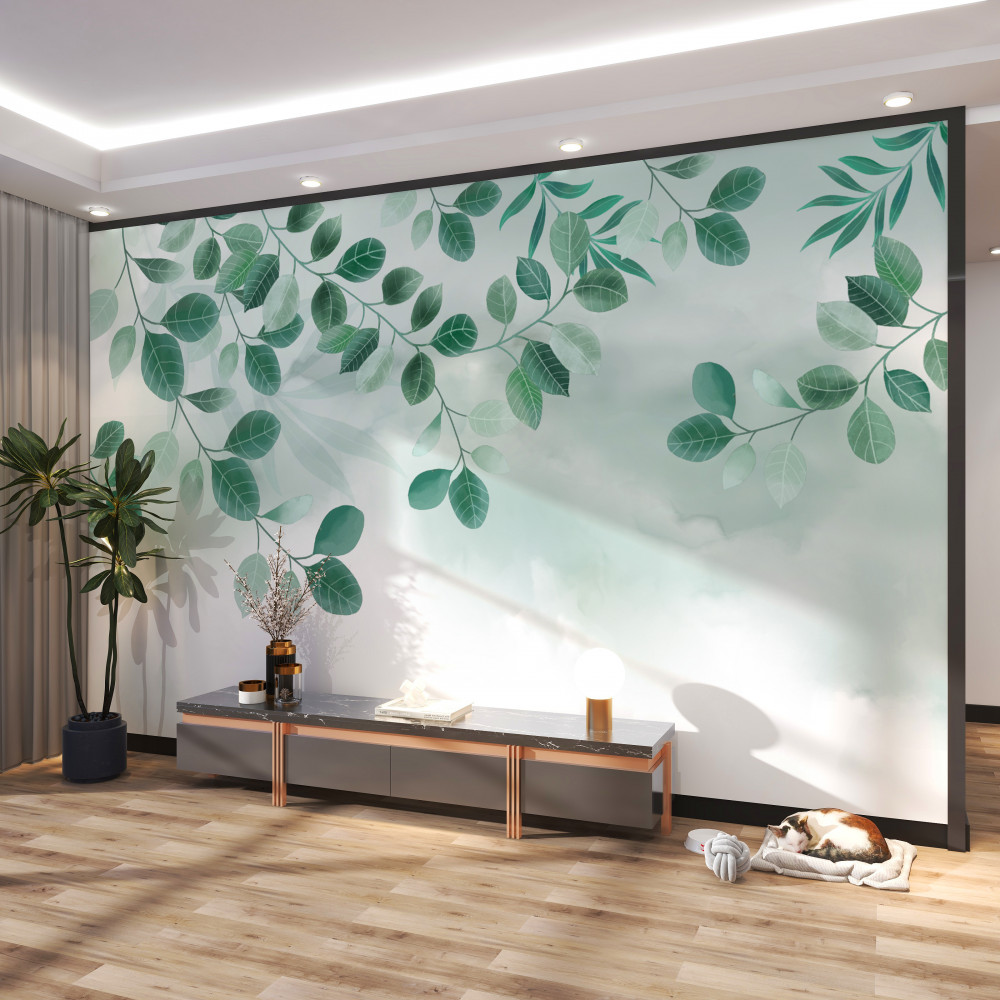 Fototapeta gałęzie z zielonymi liśćmi na niebie