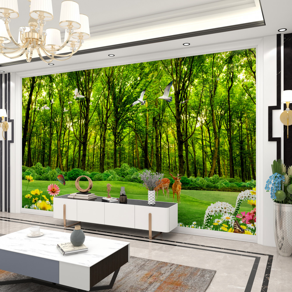 Fototapeta jelenie pasące się na łące w zielonym lesie