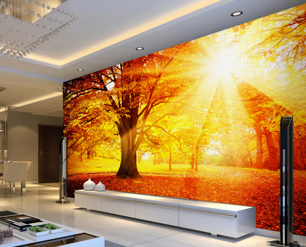 Fototapeta promienie jasnego słońca przecinają jesienną mgłę lasu