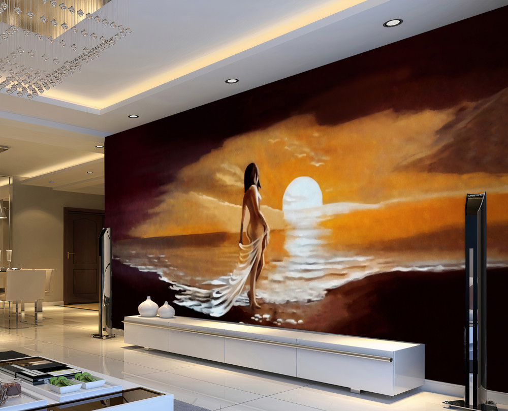 Fototapeta dziewczyna ogląda zachód słońca nad morzem