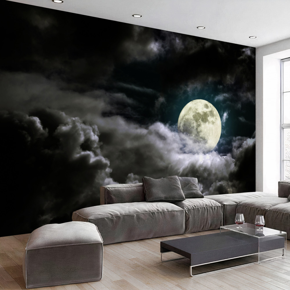 Fototapeta hipnotyzująca pełnia księżyca nad chmurami