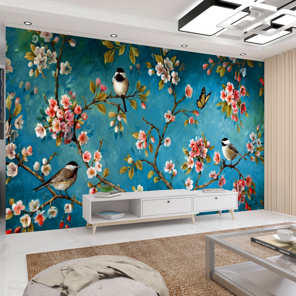 Fototapeta ptaki na kwitnących gałęziach na niebieskim tle