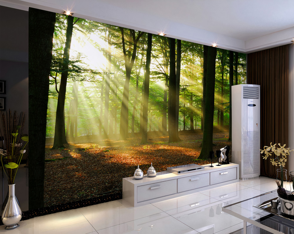 Fototapeta promienie słońca przecinają poranną mgłę w lesie