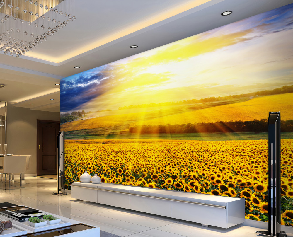 Fototapeta jasne słońce nad polem słoneczników