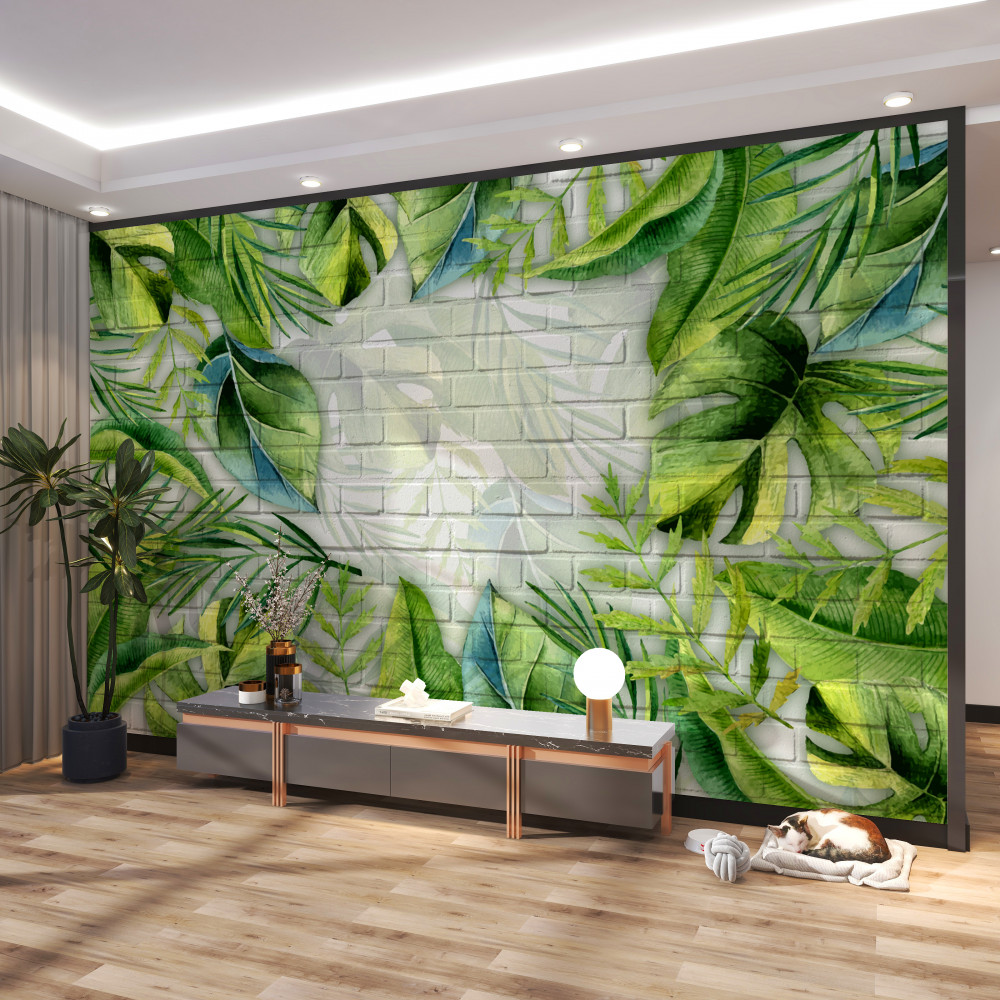 Fototapeta zielone liście tropikalne na cegle