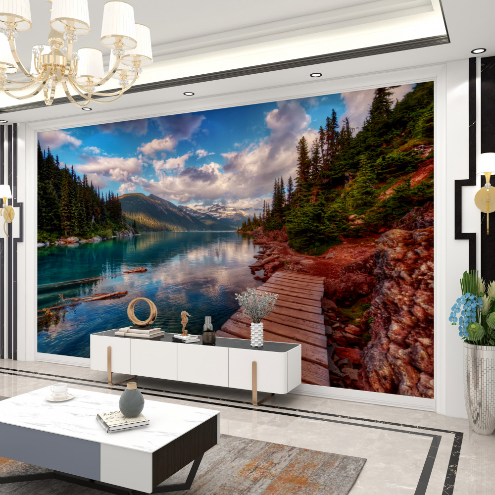 Fototapeta most prowadzący do lasu w pobliżu górskiego jeziora