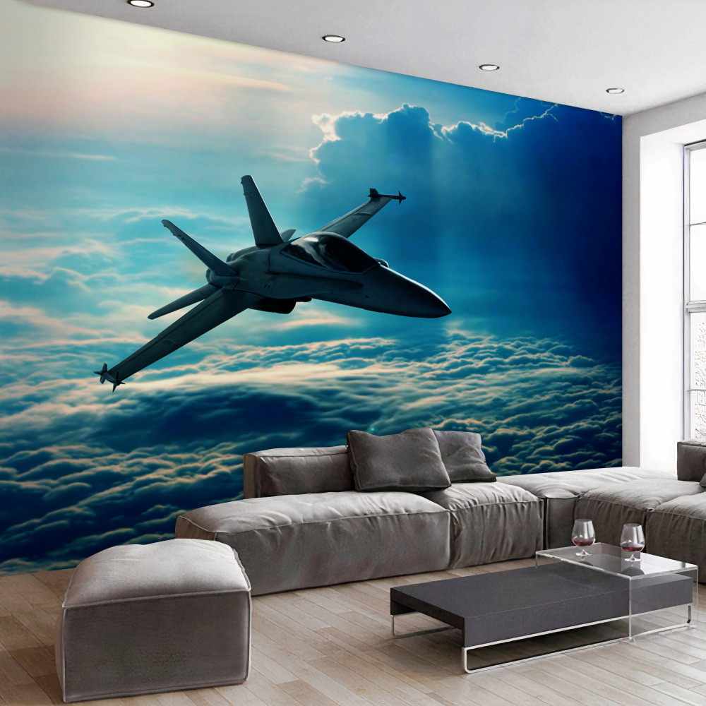 Fototapeta myśliwiec lecący przez chmury