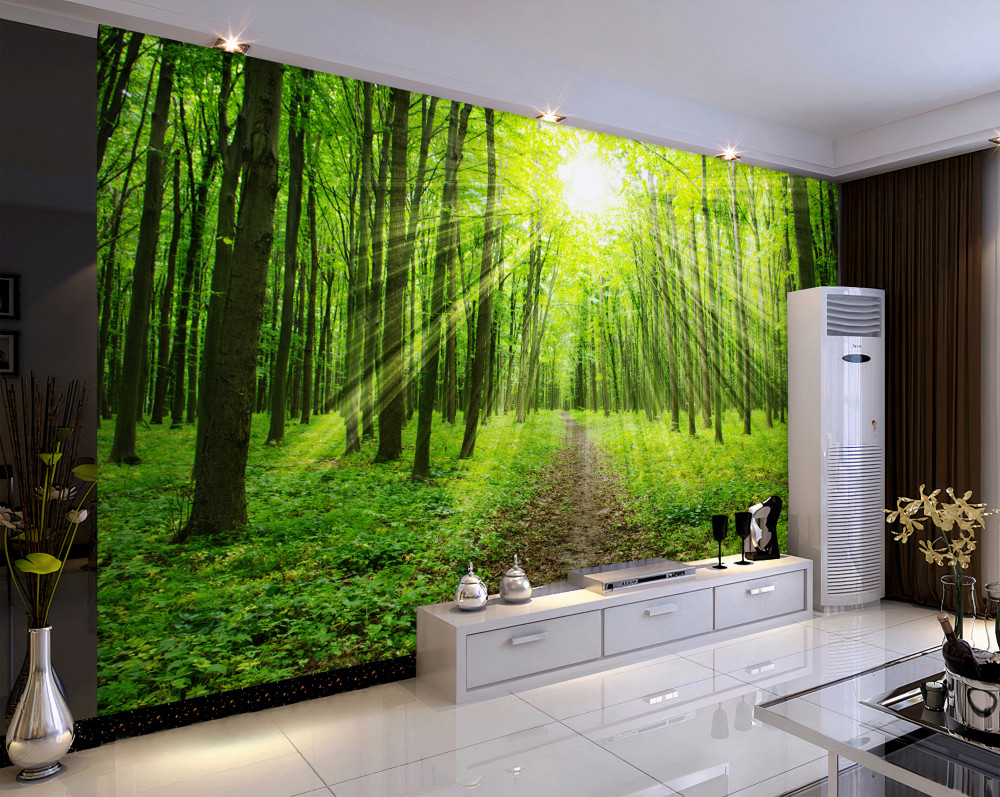 Fototapeta jasne promienie słońca w gęstym zielonym lesie