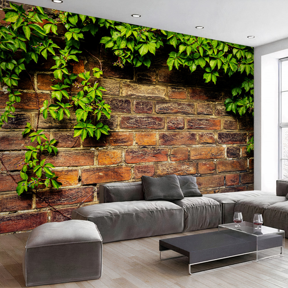 Fototapeta zielona roślinność na ścianie z cegły