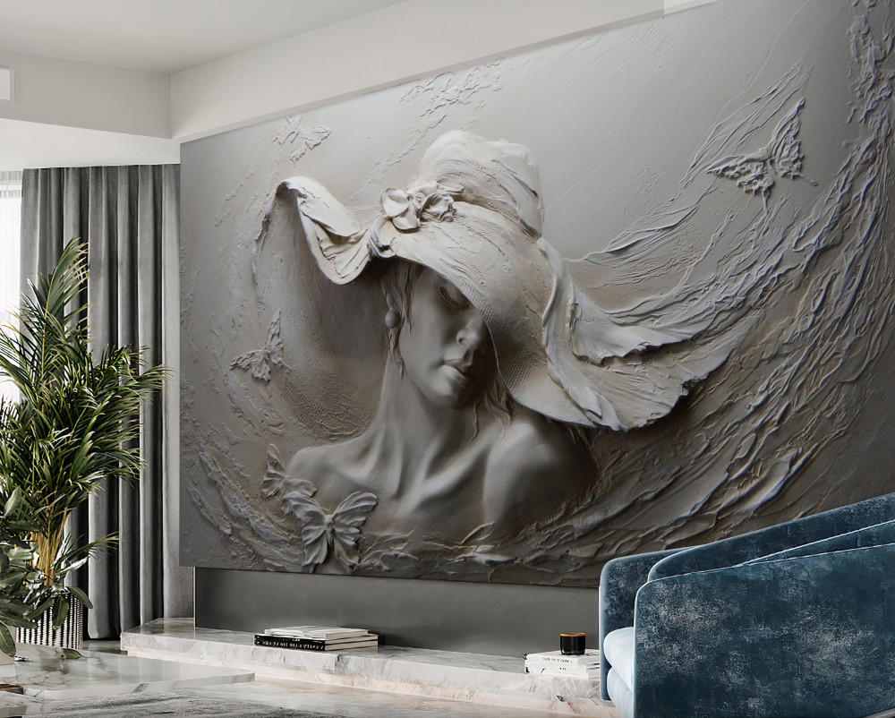 Fototapeta rzeźba na ścianie dziewczyny w kapeluszu