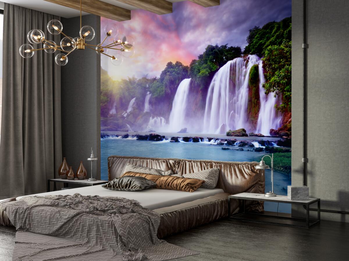 Fototapeta duży wodospad spadający o zachodzie słońca