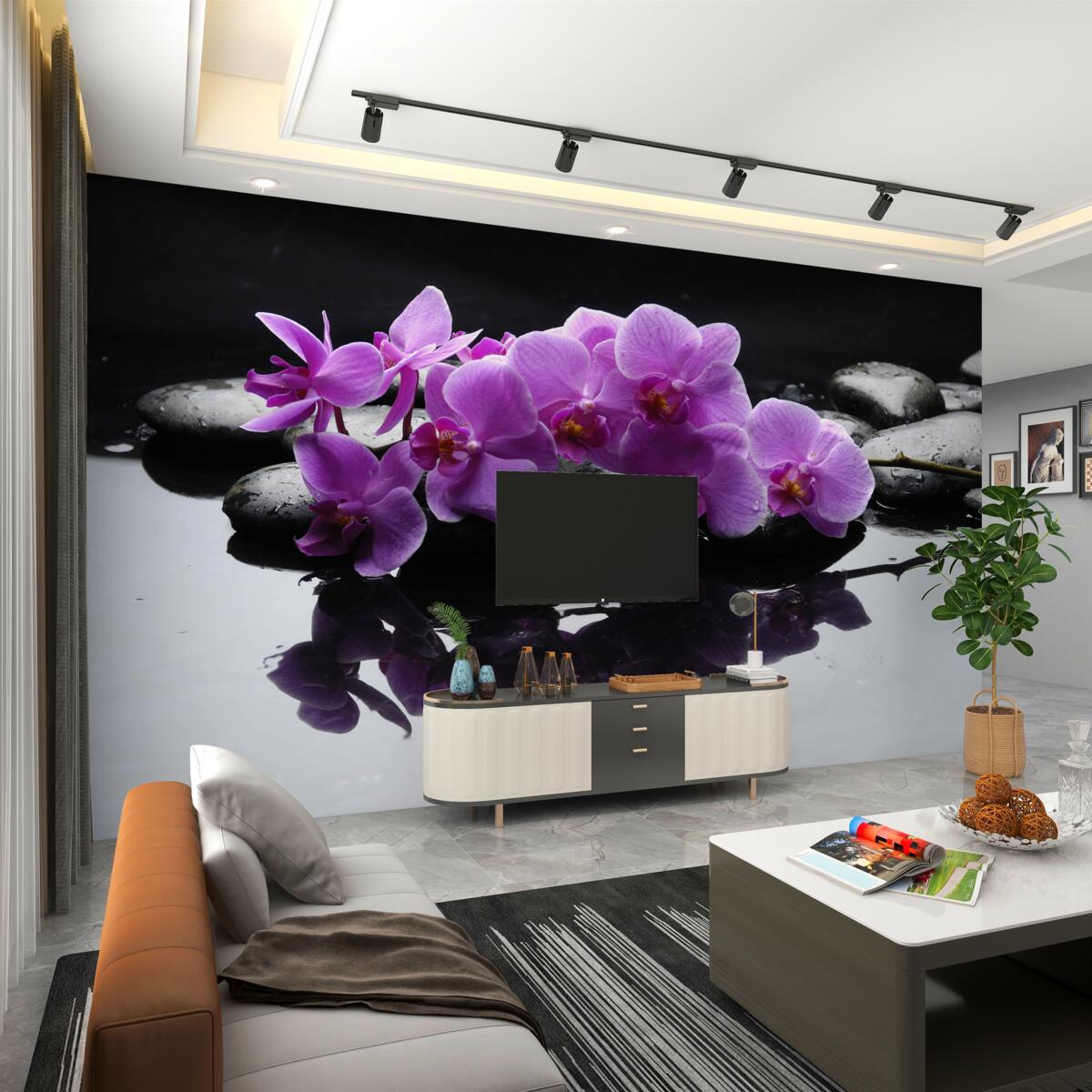 Fototapeta liliowe orchidee w pobliżu wody na kamieniu