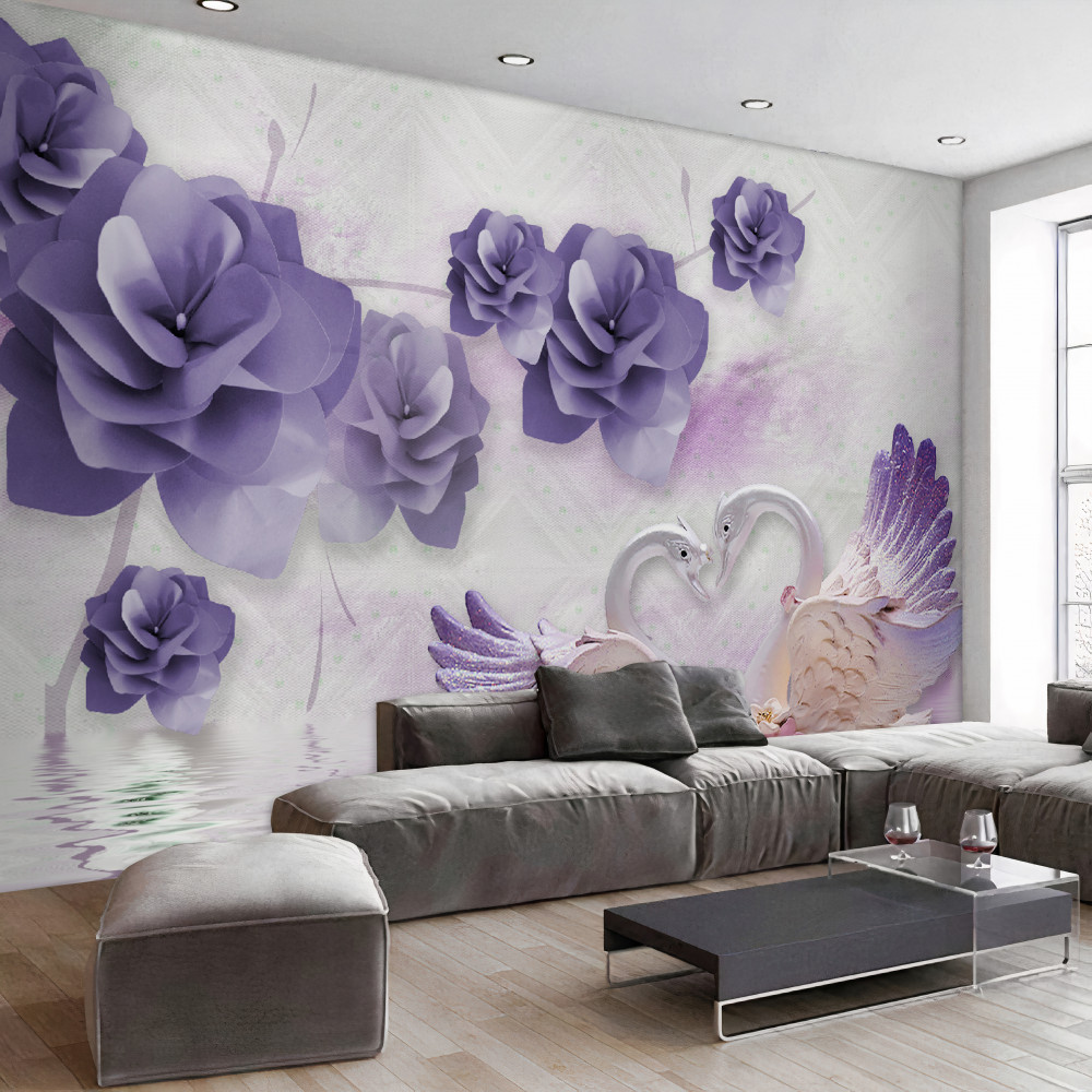 Fototapeta delikatne kwiaty i białe łabędzie na wodzie