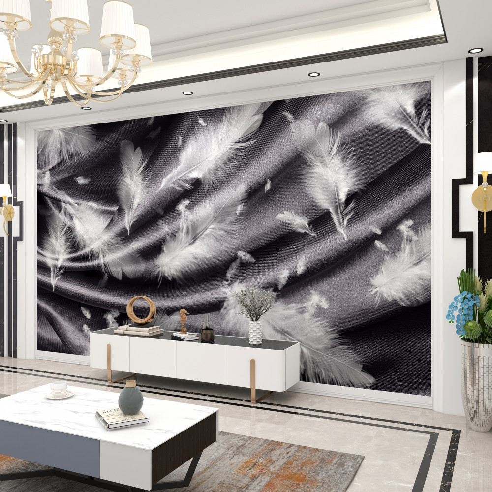 Fototapeta białe pióra leżące na szarej tkaninie