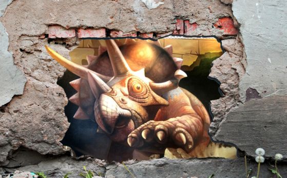 Fototapeta dinozaur niszczy kamienną ścianę