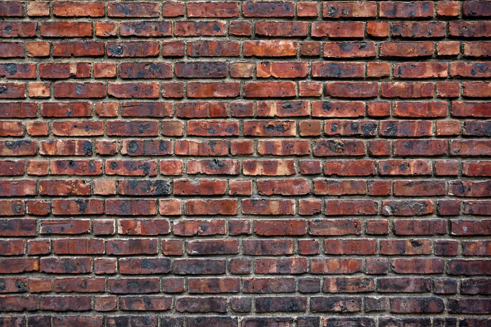 Fototapeta zabytkowy ciemny mur z cegły