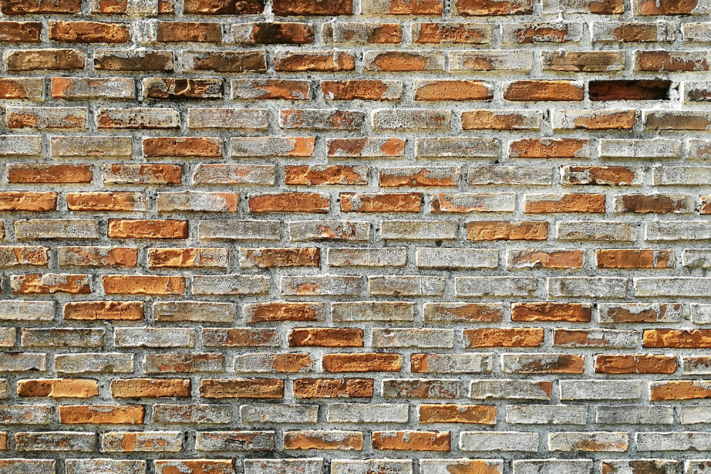 Fototapeta ściana z różnych odcieni cegły