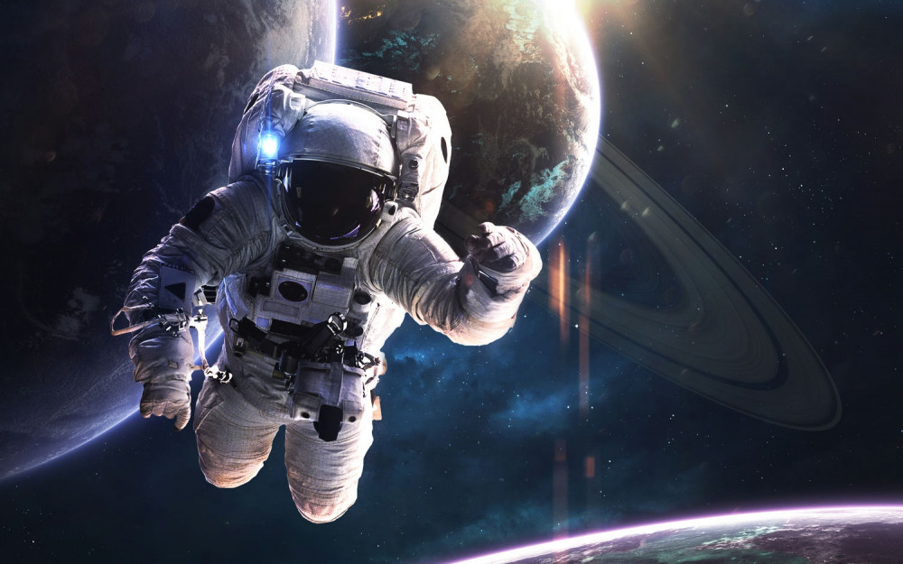 Fototapeta astronauta na tle Jowisza