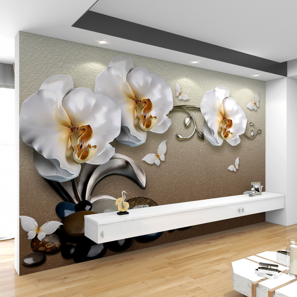 Fototapeta białe orchidee przedostają się przez kamienie