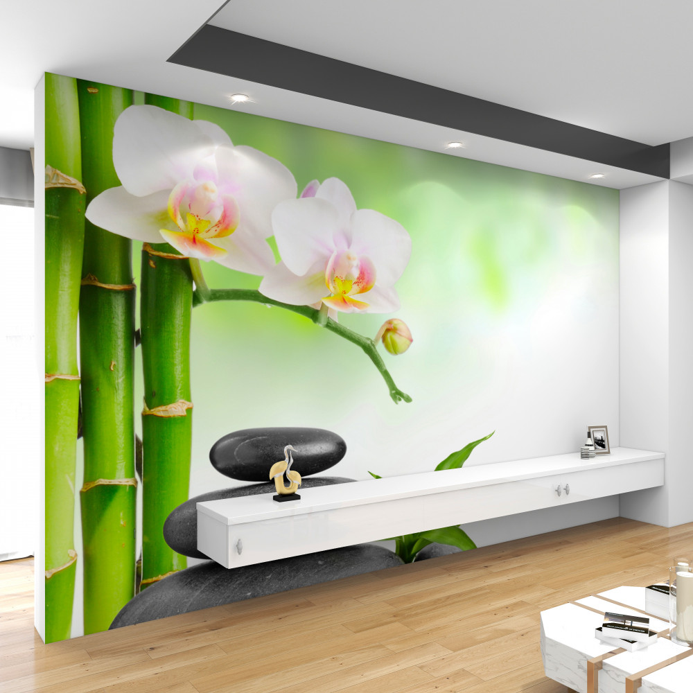 Fototapeta kamienie bambusowe i biała orchidea