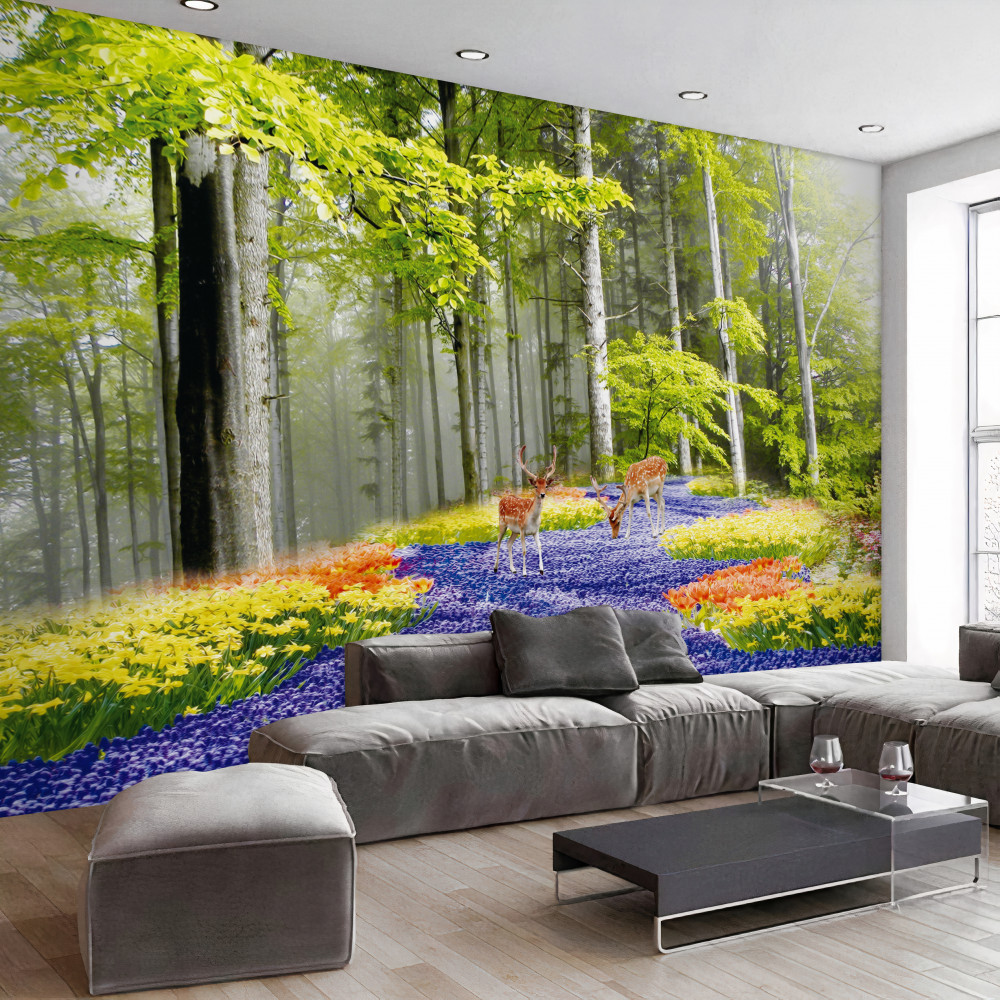 Fototapeta jelenie pasą się w zielonym lesie