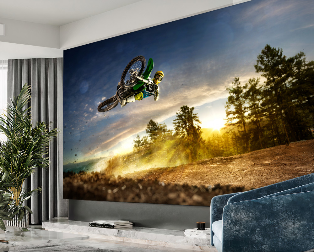 Fototapeta skok motocyklisty o zachodzie słońca
