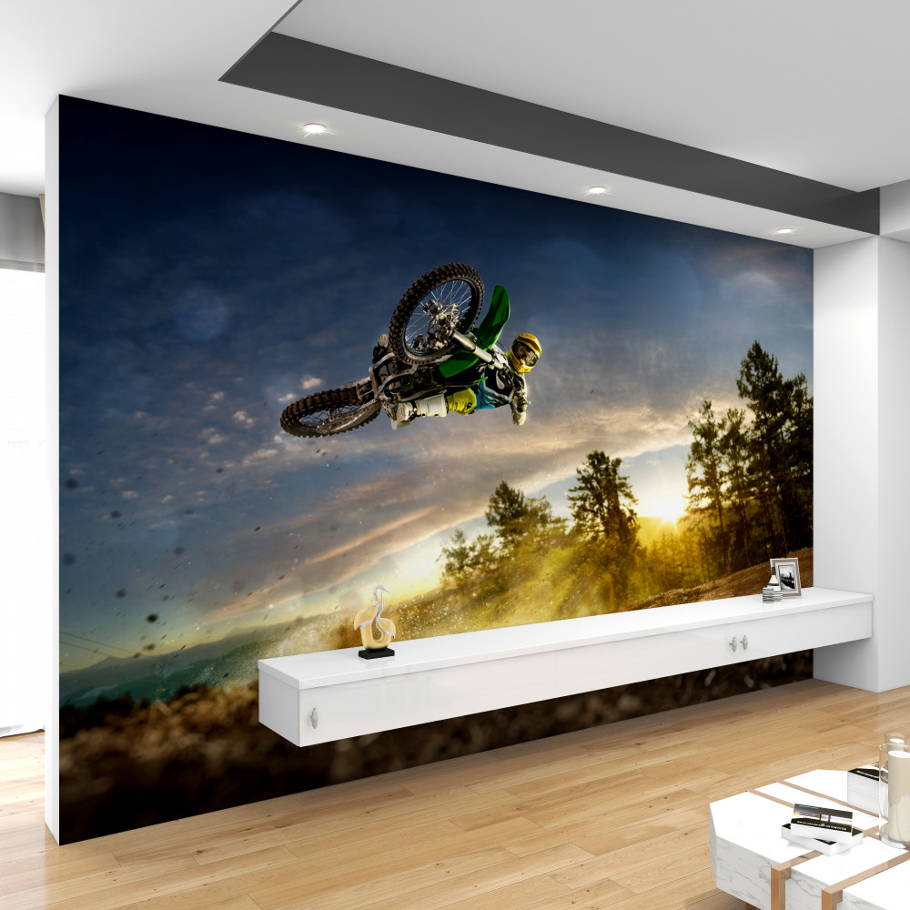 Fototapeta skok motocyklisty o zachodzie słońca
