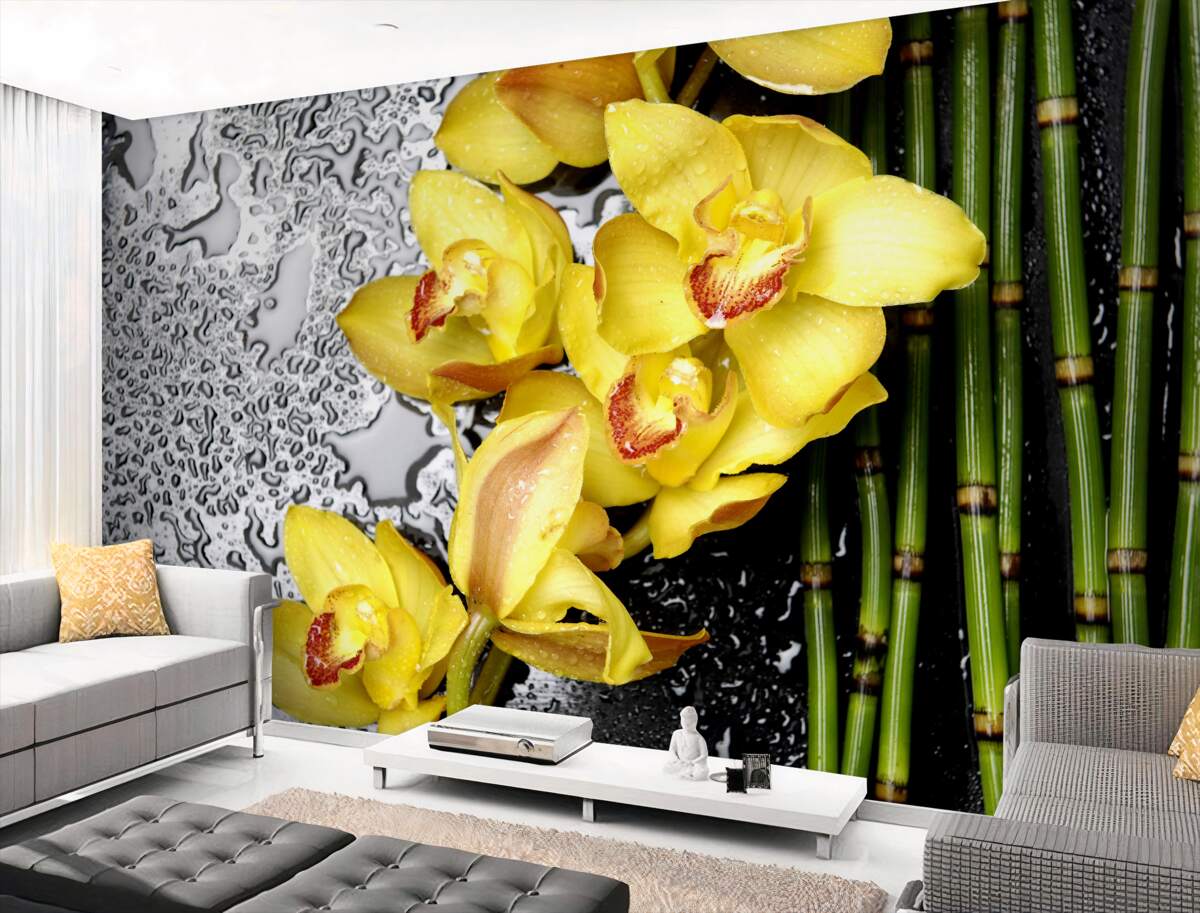Fototapeta żółta orchidea na kamieniu w pobliżu bambusa
