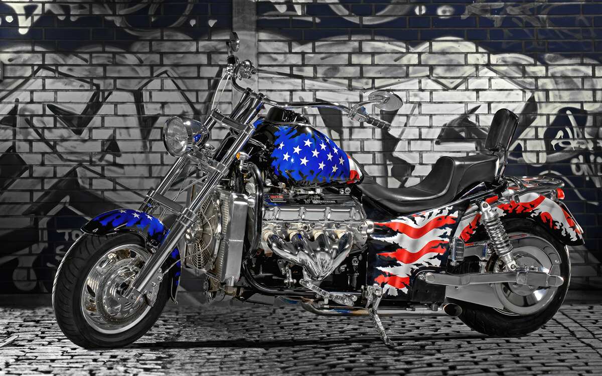 Fototapeta Motocykl na ścianie z graffiti