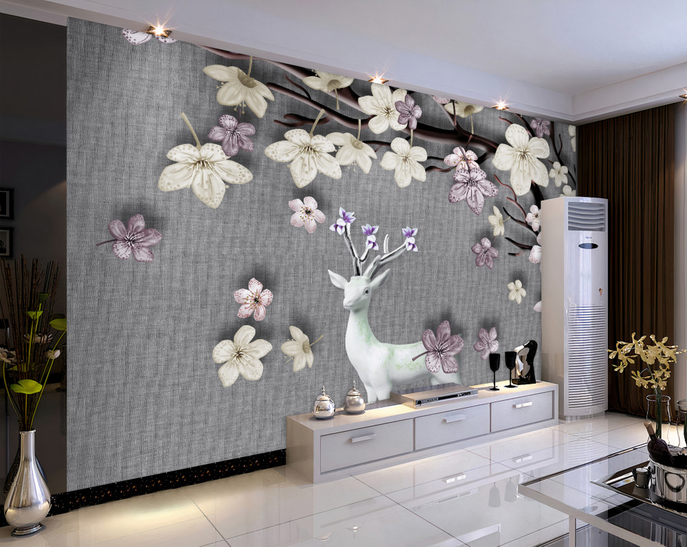 Fototapeta biały jeleń i kwitnące gałęzie magnolii