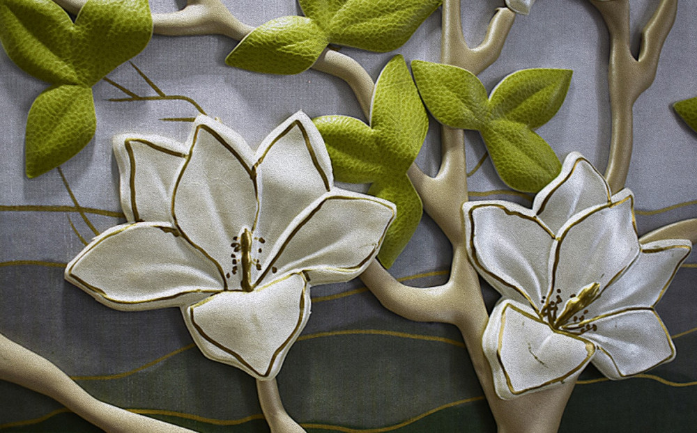 Fototapeta porcelanowe kwiaty magnolii na zielonych gałęziach